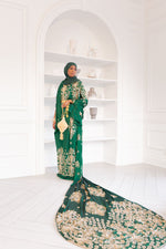 Load image into Gallery viewer, Woman wearing green Somali bridal/wedding dirac.
