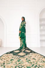 Load image into Gallery viewer, Woman wearing green Somali bridal/wedding dirac.
